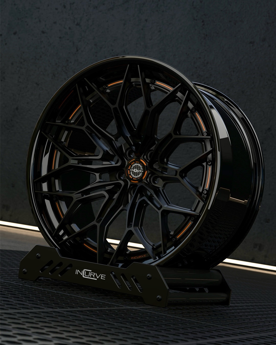 Gloss black Incurve forged wheel with bronze detailing on a display stand